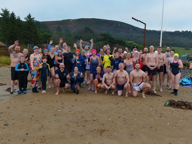 Swimmers who participated in the annual ARC Fitness New Year's Day Charity Swim at Lisfannon beach.  Photo: George Sweeney. DER2301GS  01