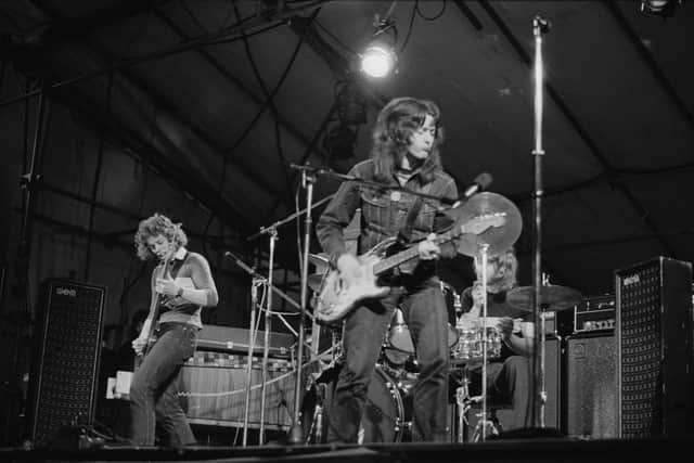 Rory Gallagher playing his 1961 Stratocaster with bassist Gerry McAvoy and drummer Wilgar Campbell at the Reading Festival in 1971. (Photo by Michael Putland/Getty Images)