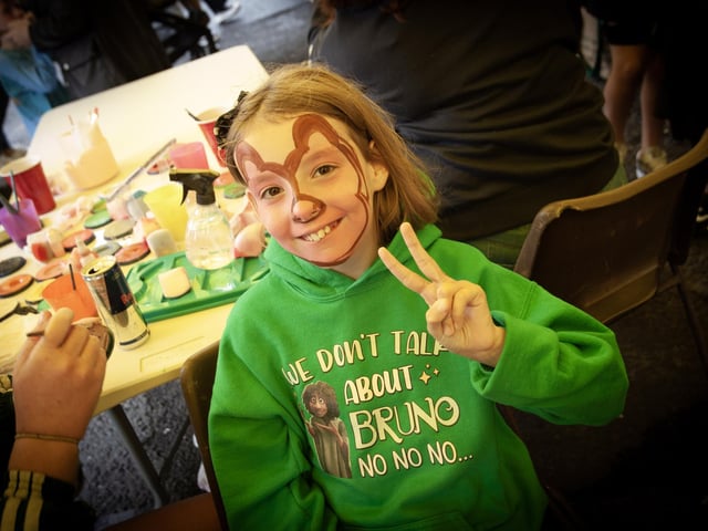 Ten years-old Faye Kelly shows off her face painting.