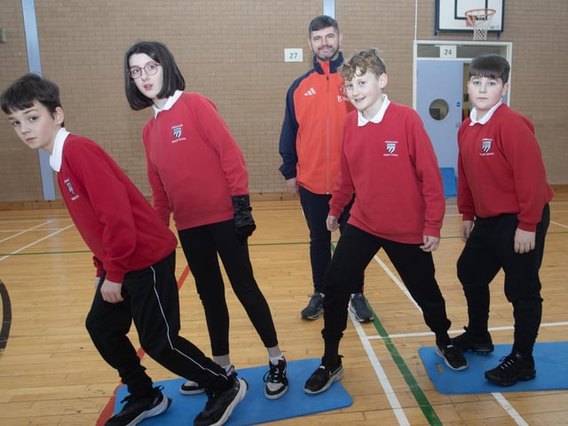 Manchester United Foundation coach Mr. Martin Smith putting Drumahoe PS P7 pupils through their paces on Monday.