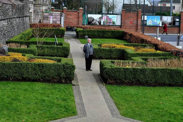 Ulster University lecturer and lawyer John Thompson pictured in the New Life Garden at Bishop Street outer, the site of the execution of Cecily Jackson, who was burned at the stake, in 1725. Photo: George Sweeney