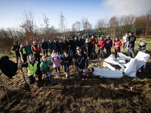 TREE PLANTING AT BAY ROAD. . . .Conor Logue, Environmental Health Officer, DCSDC and Paul McCay, The Conservation Volunteers, pictured on Saturday morning with families who took part in a Special Tree Planting Day at Bay Road Park in the city. The event saw hundreds of trees being planted as part of the Life Project where a sapling tree is planted to mark the registration of significant life events in the Council area. (Photos: Jim McCafferty Photography)