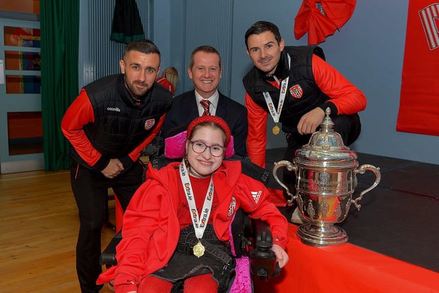 Derry City defenders Daniel Lafferty and Ciaran Coll pictured with St Eithnes Primary School principal Mr Terence McDowell and P7 pupil Seanain McCallion during a visit to the school, with the FAI Cup, on Wednesday morning. Photo: George Sweeney.  DER2246GS  076