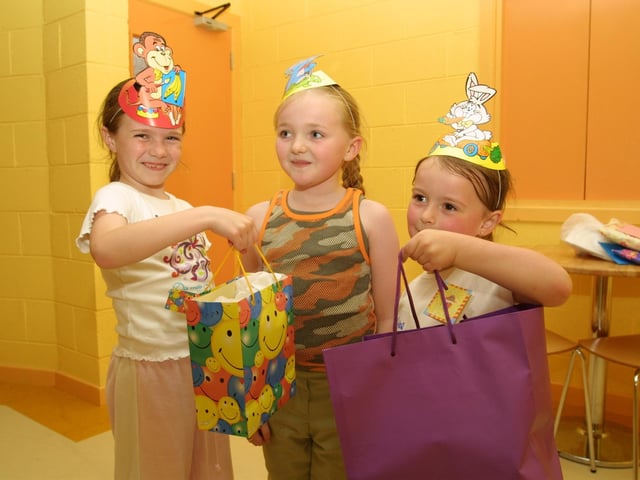 Emma Morrison and Chloe Park giving Sarah her presents