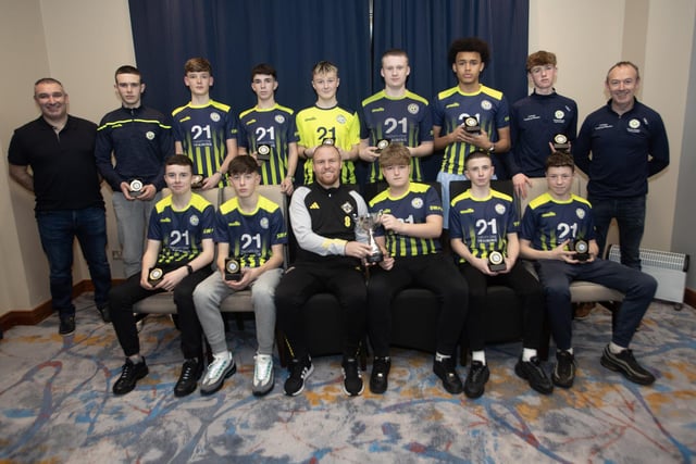 Ronan O'Donnell, Irish Football Association, special guest, presenting Sion Swifts u-15s with the Joyce Moore Cup at the D&D Youth Awards at the City Hotel on Friday night last. Included are coaches Ryan McClintock and Stephen Neeson.