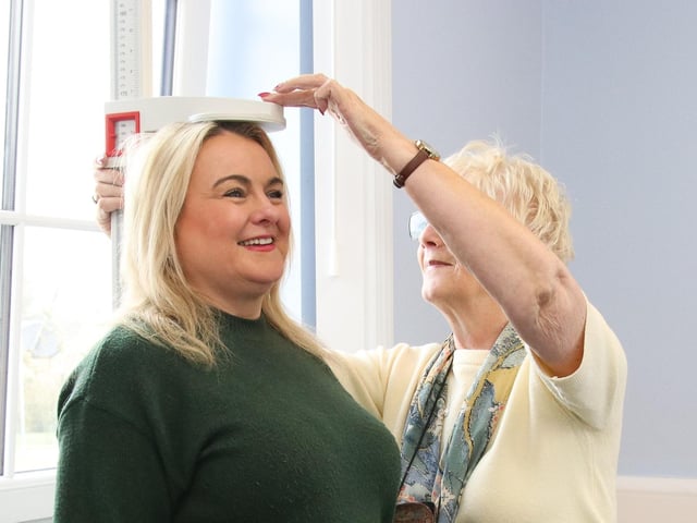 Sandra has her height checked by Veronica at Skeoge Community Health Fair. (Photo - Deirdre Heaney, nwpresspics) : NW Press Pics
