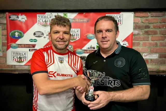 Lawrence Watson, Derry City Table Football Club, presenting the runner-up award in the Irish International Open individual competition to Wolfgang Haas.