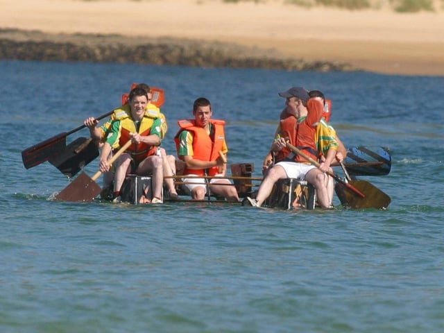 These young Rafter's take the easy option.  (0908JB04) : Clonmany Festival, Vintage Show, Agricultural Show and Raft Race in August 2005.