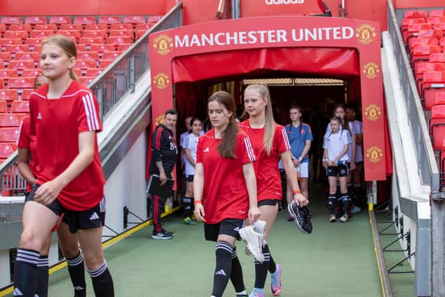 Courtney and Ava take to the pitch at Old Trafford.