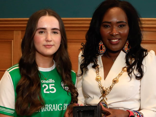 Mayor Lilian Seenoi Barr makes a presentation to Anna Gormley at a reception for Craigbane GAC and Clann na nGael GAC held in the Guildhall. (Photo - Tom Heaney, nwpresspics)