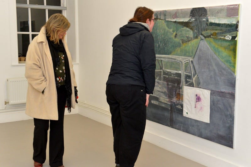 Visitors view Derry born Richard Magee’s ‘Ghost in a machine says some thing’s in the way (after Willie Doherty) exhibit at the Centre for Contemporary Art’s ‘Urgencies’ Exhibition which runs until 18th March next. Photo: George Sweeney. DER2304GS – 31