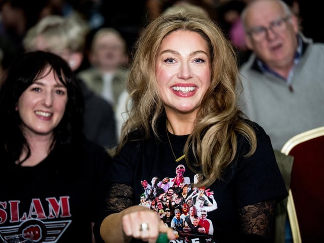 Audience members enjoying the show.