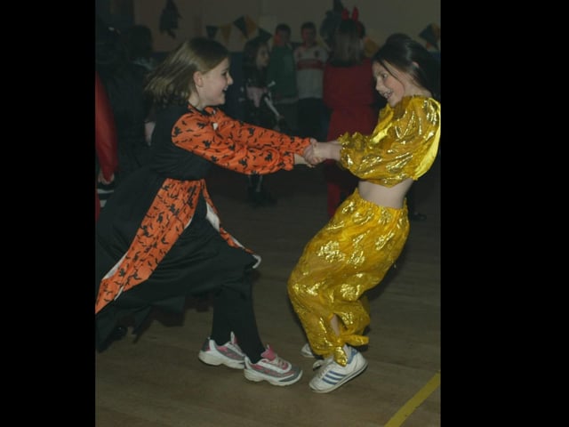 Young people boogying at a Halloween Disco in 2003