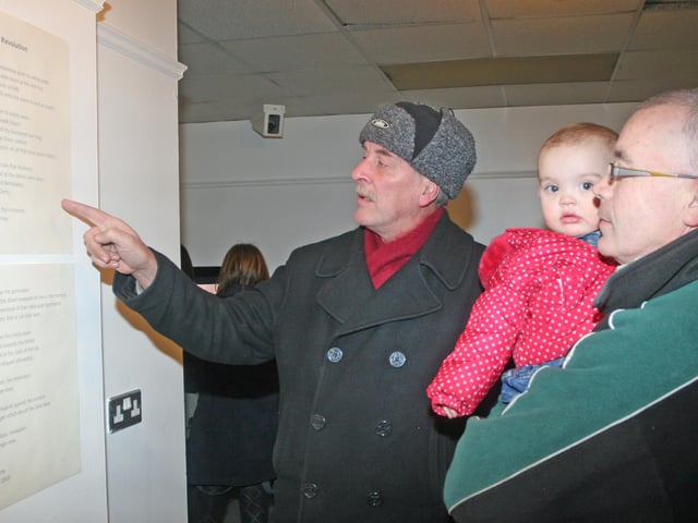 Pictured at the 'Dia as an Meaisin - God From The Machine' - an exhibition of new works by Kevin Burns at Eden Place Arts Centre in years past are Mickey Rooney and Jim Burns with his 1 year-old granddaughter Rhea McLaughlin. 0512JM04