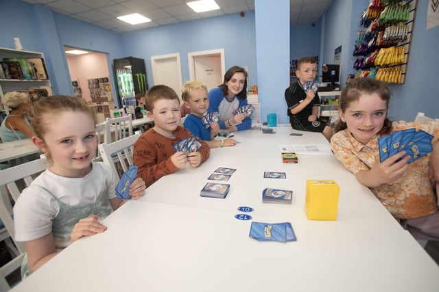 Local children enjoying Saturday's Derry Feile 24 pokemon tournament with Natsha Campbell, Pokemon instructror.