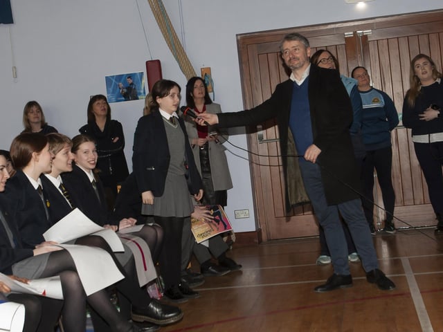 A year 8 student at Lumen Christi asks a question of Damian during Tuesday’s visit.