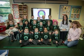Miss Maeve Flynn's Primary One class at Oakgrove Integrated Primary and Nursery School pictured on Friday last. Included are Classroom Assistants Mrs. Rachel Sherrard and Mrs. Ruth O'Callaghan. (Photos: Jim McCafferty Photography)