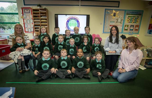 Miss Maeve Flynn's Primary One class at Oakgrove Integrated Primary and Nursery School pictured on Friday last. Included are Classroom Assistants Mrs. Rachel Sherrard and Mrs. Ruth O'Callaghan. (Photos: Jim McCafferty Photography)