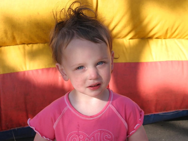 Friends together on the bouncy castle.