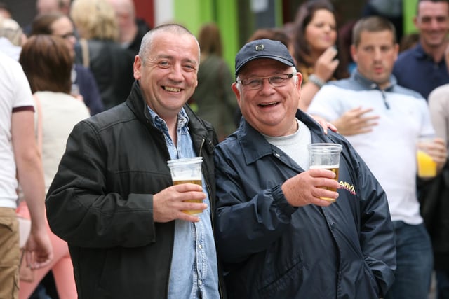 Two of the locals enjoy the craic in Waterloo Street during Sunday's Fleadh opening. DER3313JM024