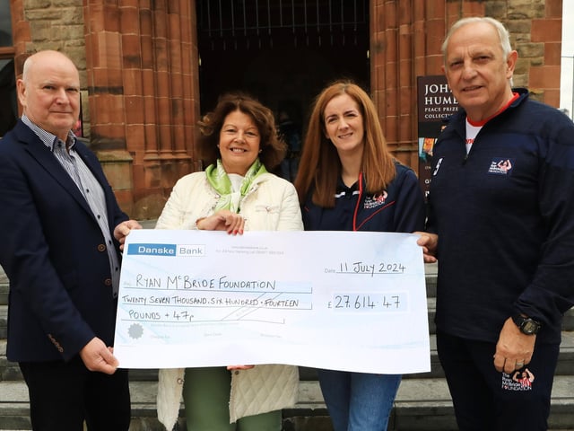 Former Mayor Cllr. Patricia Logue handing over cheque for £27,614.47 to Shaneen McBride and Andrew Cassidy (The Ryan McBride Foundation. (Photo - Tom Heaney, nwpresspics)