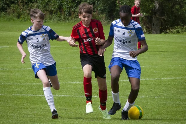 Slick defending from St. John’s Eli Okambawa during Monday’s first round game against Hillsborough Boys at Templemore. (Photos: Jim McCafferty Photography)