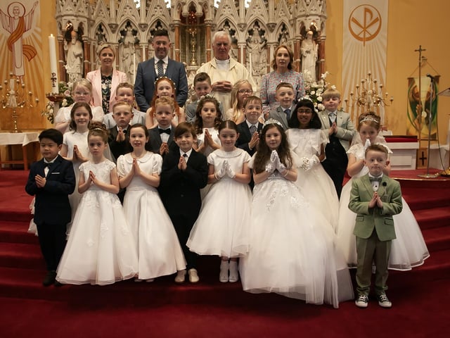 Pupils from Good Shepherd Primary School, Derry who received the Sacrament of First Holy Communion from Fr. Michael Canny at St. Columba's Church, Chapel Road on Friday last. Included at back is Mrs. Suzann McCafferty, Principal, Mr. Brendan Doran, teacher and Mrs. Doran, teacher. (Photo Jim McCafferty Photography)