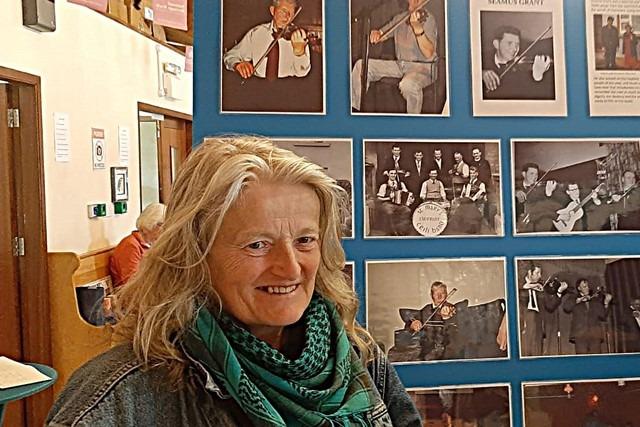 Eleanor Lambe enjoying one of the many photograph boards at the Clonmany exhibition.