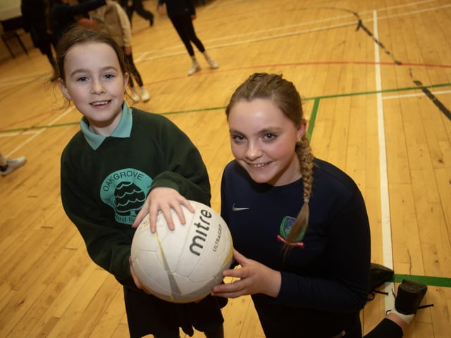 Oakgrove PS pupil Molloy Bell pictured with Year 10 PE student Emily McLucas at Monday's event.