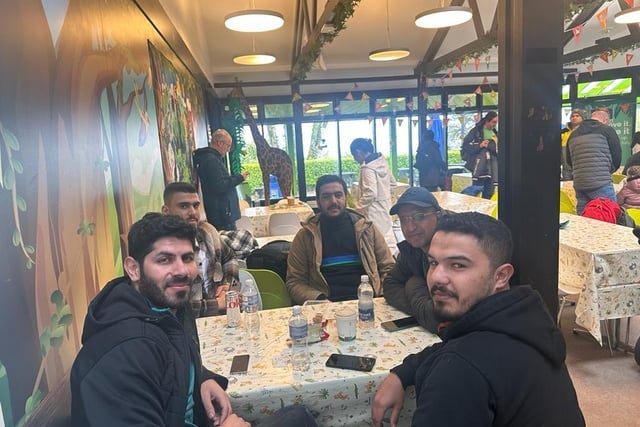 Five members of the large group who journeyed to Belfast zoo with the North West Migrants Forum on Saturday taking time out on the cafe.