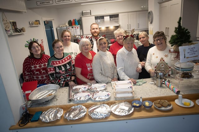 Jeanette Warke, Cathedral Youth Club pictured with staff and volunteers who served up the food for the Annual Senior Citizens Christmas Party in the club last week. (Photos: Jim McCafferty Photography)