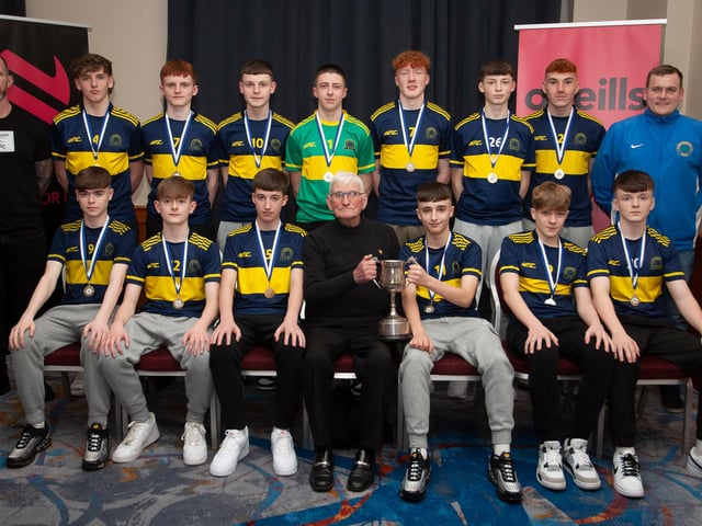 John ‘Jobby’ Crossan presenting the League Trophy to Don Boscos 2007s, at the Annual Awards in the City Hotel on Friday night last. Included are coaches Davy Ferguson and Emmett Kirk.