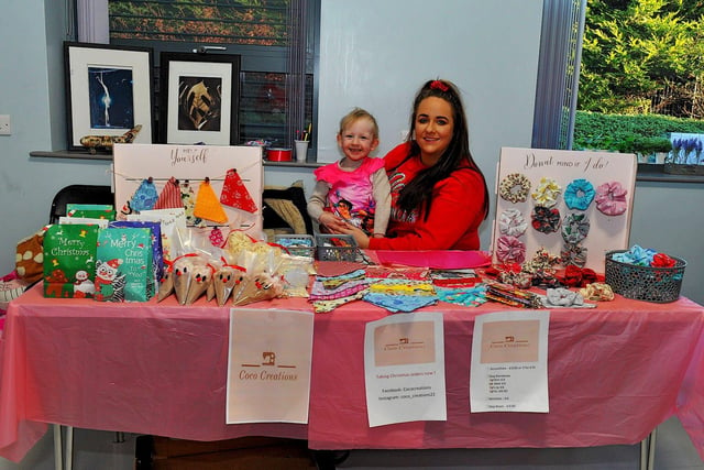 Erin Moore and Rhia O’Kane at her stall at the Christmas Craft Fair held in the Galliagh Community Centre on Saturday afternoon. Photo: George Sweeney. DER2250GS – 78