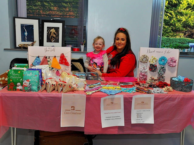 Erin Moore and Rhia O’Kane at her stall at the Christmas Craft Fair held in the Galliagh Community Centre on Saturday afternoon. Photo: George Sweeney. DER2250GS – 78