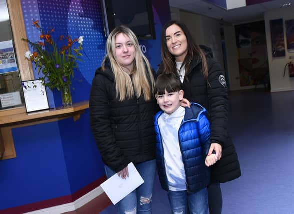 Oakgrove College A Level student Courtney Wright with her mum Louise and little brother Logan.