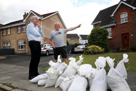 Former Infrastructure Minister John O'Dowd visiting residents at Ivy Mead on a previous occasion. (PressEye)