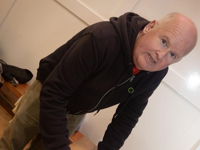Creggan resident Brian McLaughlin filling in a questionnaire after Thursday night's 'Human Library' event.