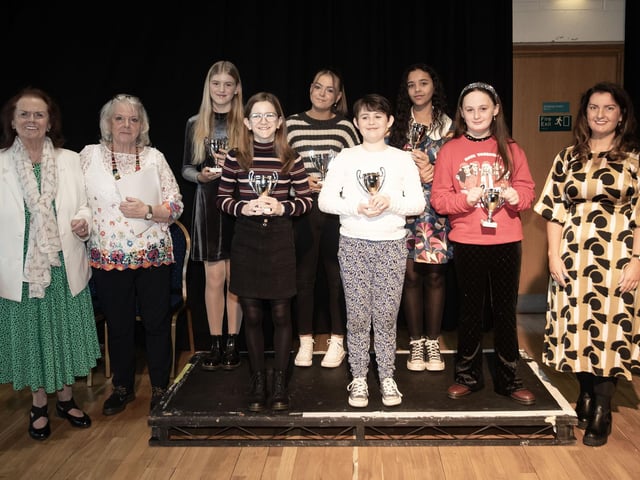 Una O'Somachan, Maire Worth and Blathnaid Biddle pictured with the intermediate class group at last week's Charity Feis.