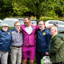 Micky Doherty with people supported by Praxis Care.