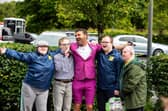 Micky Doherty with people supported by Praxis Care.