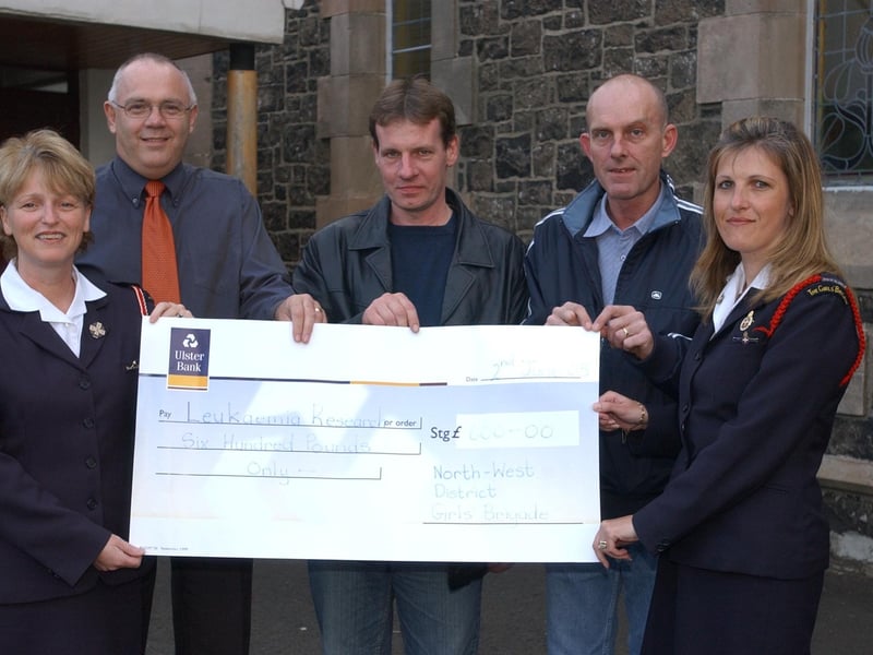 Members of the North West Girls Brigade present the Foyle Branch of Leukaemia Research with a cheque for £600.