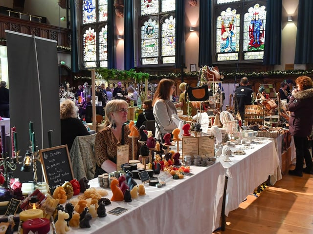 People browse the large range of gifts at the Guildhall Christmas Fair on Friday afternoon. Photo: George Sweeney / Derry Journal