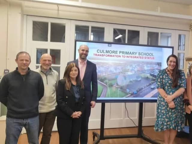 Principal Clare McMenamin with local MLAs during their visit.