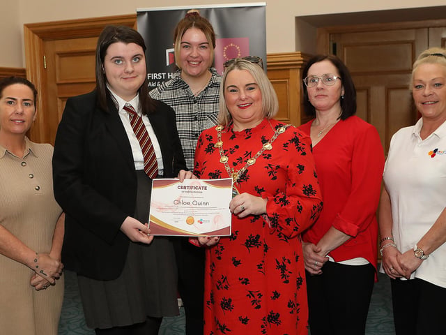 Mayor presents a certificate to Chloe Quinn, a student at St. Brigid's College, for completing the following courses, food hygiene, health and safety and First Aid. The course was held at Skeoge Community Hub in partnership with St. Brigid's College. Included on left are Nicola Mullan, Kelly McCauley and from right Cathy Green and Karen Quinn. (Photo - Tom Heaney, nwpresspics)