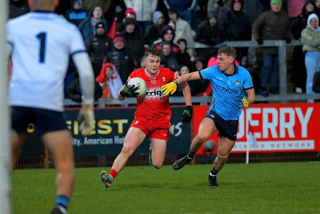 Cormac Murphy of Derry shields the ball from Dublin's Cian Murphy. Photo: George Sweeney