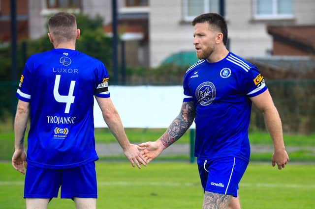 Trojans Gearoid McDermott celebrates a goal with a handshake from teammate Marc Doherty in the match against Tobermore Utd. in the Ballymena and Provincial League game held in Oakland Park. (Photo - Tom Heaney, nwpresspics)