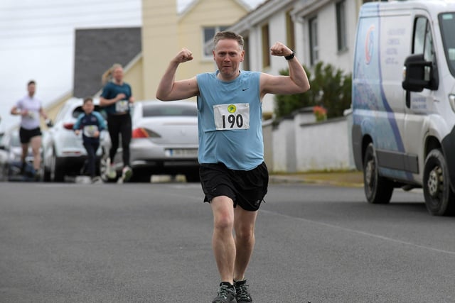 A happy competitor in the Tomás memorial 5k run held in Moville on Sunday morning.  Photo: George Sweeney