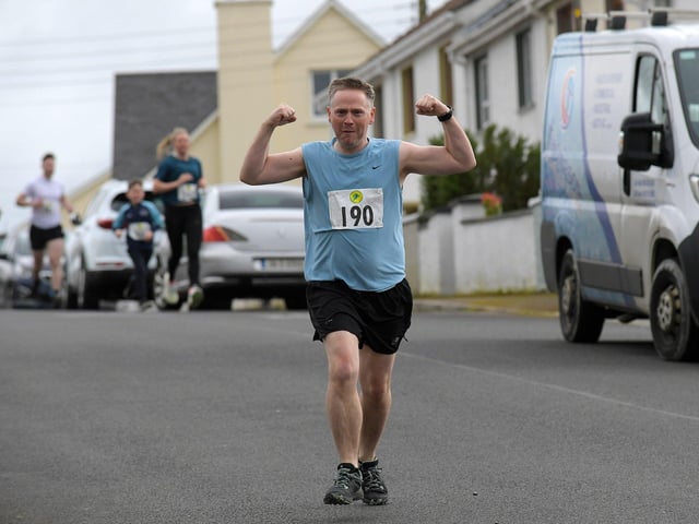 A happy competitor in the Tomás memorial 5k run held in Moville on Sunday morning. Photo: George Sweeney