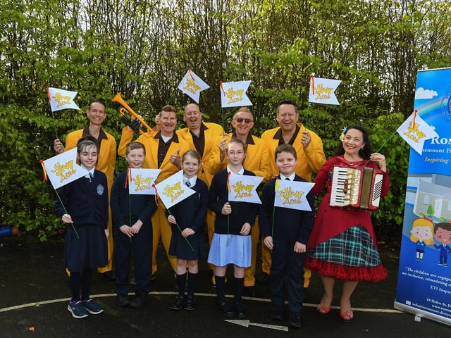 The Jive Aces pictured with pupils Katie, Hayden, Aoibheann, Ava and Lochlann at Rosemount Primary School on Thursday morning. Photo: George Sweeney