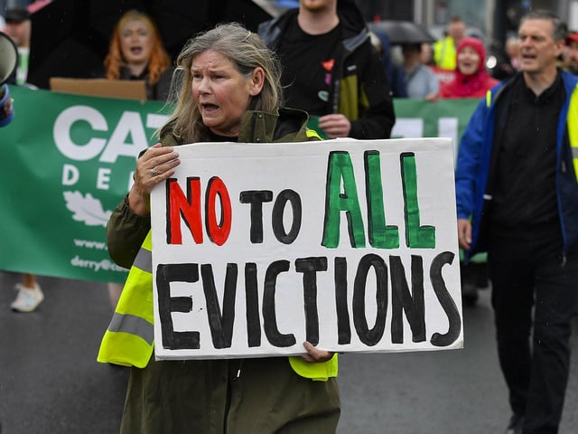 Participants carry placards during the Derry Housing Action Committee protest march over housing crisis on Saturday afternoon Photo: George Sweeney